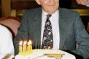 Charlie Carriban on his 80th birthday. His cake had a picture of a crane on it.