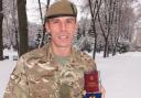 CSgt Stuart Collins with his medal for his work in Ukraine. Photo: Mercian Regiment.