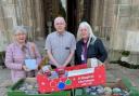 Chris Hall with Arden Foodbank receiving its food donation and cheque at Studley Castle