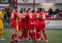 Redditch United players celebrate on their way to beating champions Needham Market 3-0