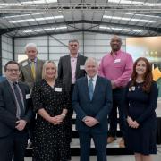 Local businesses, dignitaries and industry representatives come together