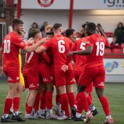 Redditch United players celebrate on their way to beating champions Needham Market 3-0