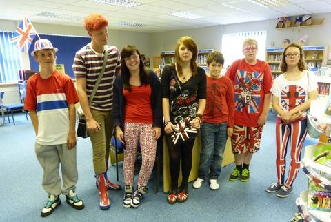 Alcester Academy students held a contest for the most patriotic outfit: (from left) finalists Aaron Styler, Tom Leonard, Chloe Jones, Jenny Udall, Tom Emment, Tom Williams and Amber Paddock. Image courtesy of Helen Black.