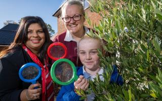 Redrow Sales Supervisor Jinni Aspinall with Sarah Cowling- Wildlife and Community Officer for the Wildlife Trust - bug hunting with pupils