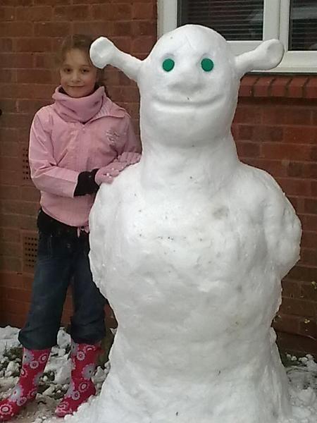 Stuart, Charlie (pictured) and Oliver Coombes with their "Snow Shrek".