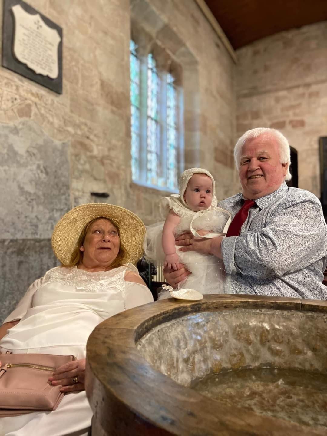 Carol and Nigel Joyce with their granddaughter