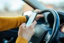 A man has been ordered to pay hundreds of pounds after using his mobile phone behind the wheel.