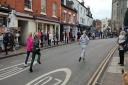 The historic pancake day race returned to Alcester.