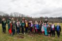 Children from Mappleborough Green C of E Primary School at the planting with the Heart of England Forest team.