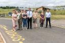 After a meeting between the school, councillors,  Persimmon Homes and the town's MP, a temporary barrier has been installed.