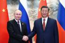 Chinese President Xi Jinping and Russian President Vladimir Putin pose for a photo (Sergei Guneyev, Sputnik, Kremlin Pool Photo via AP)