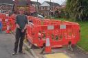 Internet companies are causing repeated disruption in Pershore, Pershore town councillor Dan Boatright-Greene next to the works