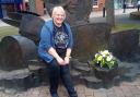 Ros Sidaway, festival director, at the John Bonham Memorial with flowers laid to commemorate the 41st anniversary of his death.