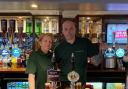 Julie Hossack and Ian May behind the bar of the newly reopened Woodland Cottage.