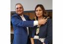 Councillor Begum receiving the chain of office from the outgoing mayor Salman Akbar