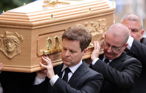 Redditch Advertiser: Declan carries his brother's coffin. Picture: NORTH NEWS