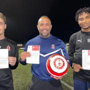 Manager Matt Clarke (centre) with Redditch United players Luke Rowe and Tiago.