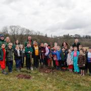Children from Mappleborough Green C of E Primary School at the planting with the Heart of England Forest team.