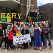 Hands Off Redditch Library campaign group has marked the first birthday of Redditch Library's scaffolding.