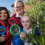 Redrow Sales Supervisor Jinni Aspinall with Sarah Cowling- Wildlife and Community Officer for the Wildlife Trust - bug hunting with pupils