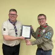 Chief Scout for Warwichshire Paul Wakeley (left) presenting the award to Matthew Cook (right)