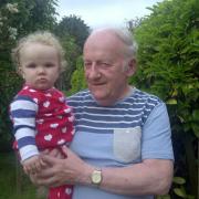 Bob Davis holding his great-granddaughter Molly
